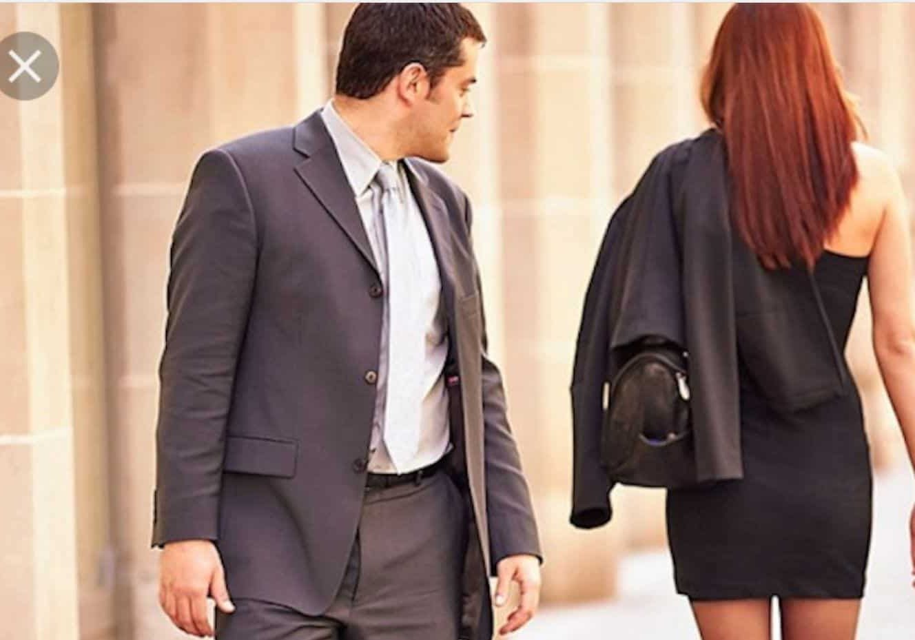 man looking at checking out woman