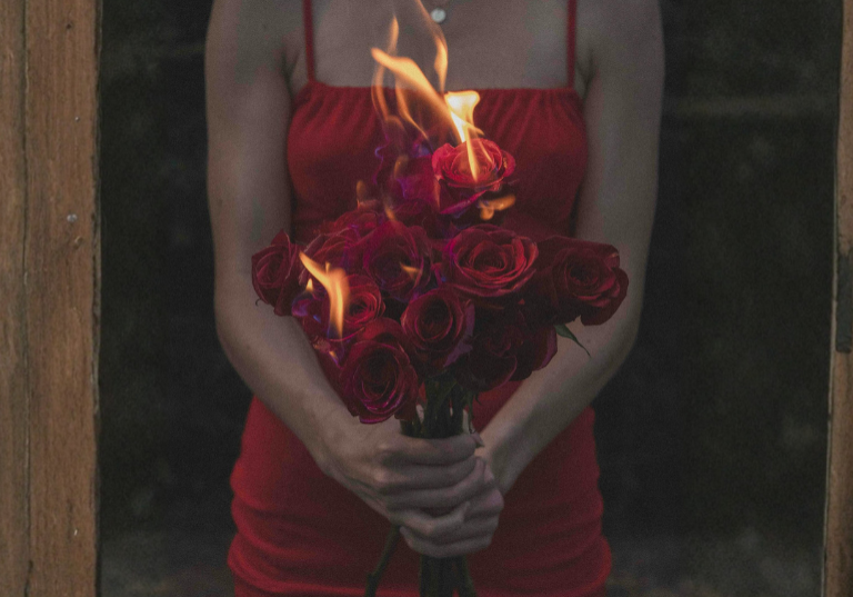 pexels-eli-searcy-edited-woman-in-a-red-dress-holding-a-bouquet-of-burning-roses-19227041